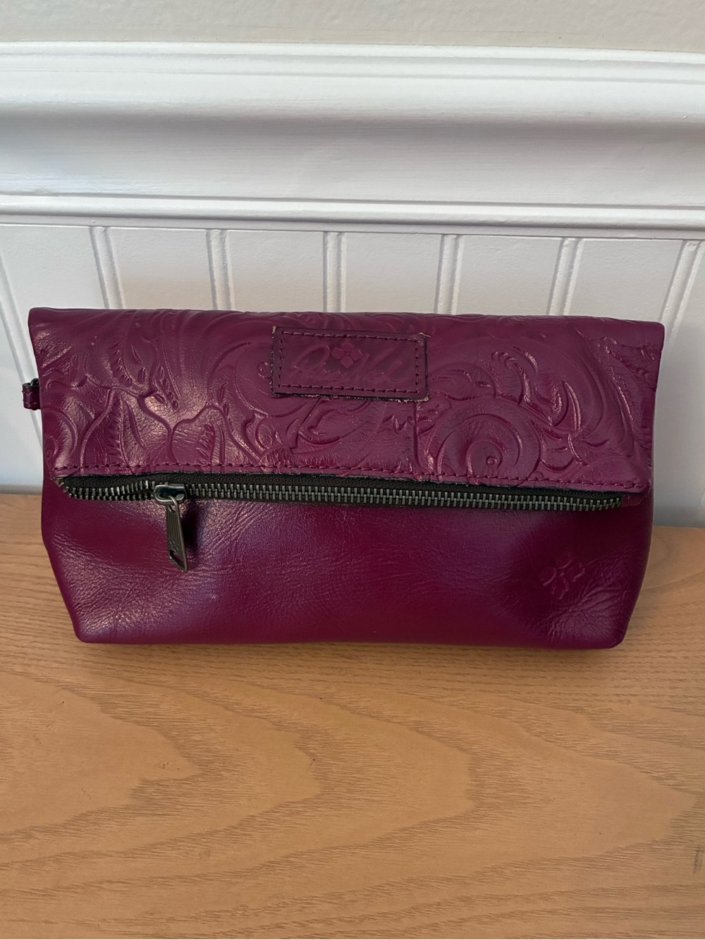 Patricia Nash Valerie fold-over wristlet in cranberry tooled leather - Picture 1 of 10